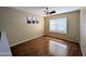 Cozy bedroom with natural light, ceiling fan, and neutral color scheme at 8861 W Paradise Dr, Peoria, AZ 85345