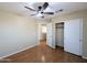 This bedroom features wood floors and a sliding-door closet at 8861 W Paradise Dr, Peoria, AZ 85345