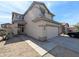 Two-story home with a xeriscaped front yard and an attached two-car garage at 8861 W Paradise Dr, Peoria, AZ 85345