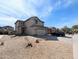 Two-story home with a xeriscaped front yard and attached two-car garage at 8861 W Paradise Dr, Peoria, AZ 85345