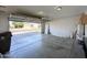 Spacious garage with an open door showing a view of the neighborhood at 8861 W Paradise Dr, Peoria, AZ 85345