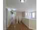 Bright hallway with wood floors and natural light, offering a welcoming transition between living spaces at 8861 W Paradise Dr, Peoria, AZ 85345