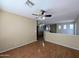 Open loft area with wood floors, ceiling fan, and natural light at 8861 W Paradise Dr, Peoria, AZ 85345