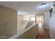 Bright hallway with wood floors and natural light, offering a welcoming transition between living spaces at 8861 W Paradise Dr, Peoria, AZ 85345