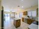 Open-concept kitchen featuring stainless steel appliances and a center island at 8861 W Paradise Dr, Peoria, AZ 85345