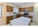 Well-lit kitchen featuring stainless steel appliances and a convenient center island at 8861 W Paradise Dr, Peoria, AZ 85345