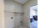 An unfinished laundry room with a shelf and utility hookups at 8861 W Paradise Dr, Peoria, AZ 85345