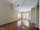 Spacious living room featuring wood floors, large windows, and natural lighting at 8861 W Paradise Dr, Peoria, AZ 85345