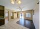 Bright living room featuring stylish built-ins, ceiling fan, and sliding door to backyard at 8861 W Paradise Dr, Peoria, AZ 85345