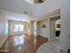 Bright living room with hardwood floors, large windows, and decorative wall art at 8861 W Paradise Dr, Peoria, AZ 85345