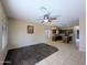 Open living space that includes a ceiling fan, recessed lights, and a view of the kitchen at 8861 W Paradise Dr, Peoria, AZ 85345