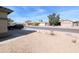 View of a neighborhood street with homes with xeriscaped front yards and desert vegetation at 8861 W Paradise Dr, Peoria, AZ 85345