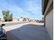 View of a street with multiple homes and cars parked in driveways, with blue skies at 8861 W Paradise Dr, Peoria, AZ 85345