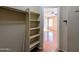 Spacious walk-in closet with shelving and hanging rails, connecting to the Primary bedroom at 8861 W Paradise Dr, Peoria, AZ 85345