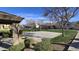 Community basketball court surrounded by mature trees and landscaping at 910 W Aspen Way, Gilbert, AZ 85233