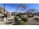 Community park with a playground, ramada, and lush landscaping at 910 W Aspen Way, Gilbert, AZ 85233