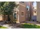 Exterior view of a home featuring neutral-toned siding, dark shutters, and drought-resistant landscaping at 910 W Aspen Way, Gilbert, AZ 85233