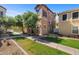 Charming two-story townhome with mature trees, green grass and well maintained landscaping at 910 W Aspen Way, Gilbert, AZ 85233