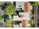 Overhead view of homes with terracotta roofs, manicured lawns, and mature trees at 9115 W Kimberly Way, Peoria, AZ 85382