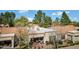 Aerial view of private backyard patio with seating and BBQ in a lush green setting at 9115 W Kimberly Way, Peoria, AZ 85382