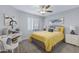 Comfortable bedroom with a decorative ceiling fan, yellow bedding, and a matching yellow pillow at 9115 W Kimberly Way, Peoria, AZ 85382