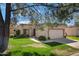 Charming single-story home featuring well-manicured lawn and two-car garage at 9115 W Kimberly Way, Peoria, AZ 85382