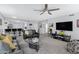 Spacious living room featuring an open layout connecting to the kitchen and dining areas at 9115 W Kimberly Way, Peoria, AZ 85382