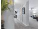 Neutral hallway leading to a living room with contemporary furnishings and carpet flooring at 9115 W Kimberly Way, Peoria, AZ 85382