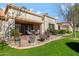 Charming outdoor patio with a dining table and grill, perfect for entertaining at 9115 W Kimberly Way, Peoria, AZ 85382