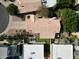 Aerial view showcasing the home with a well-kept yard and tiled roof at 9224 E Windrose Dr, Scottsdale, AZ 85260