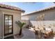 Cozy backyard featuring a stone pathway, raised garden beds, and a charming entrance at 9224 E Windrose Dr, Scottsdale, AZ 85260