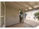 Enclosed patio area featuring a covered space and a view of the surrounding landscape, perfect for outdoor living at 9224 E Windrose Dr, Scottsdale, AZ 85260