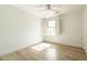 Bright bedroom with wood floors, a window, and a ceiling fan at 9224 E Windrose Dr, Scottsdale, AZ 85260