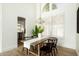 Modern dining room with wooden table, black chairs, and stylish decor at 9224 E Windrose Dr, Scottsdale, AZ 85260