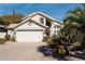 Charming single-Gathering home featuring a two-car garage and desert landscaping at 9224 E Windrose Dr, Scottsdale, AZ 85260