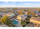 Aerial view of the home featuring a pool, solar panels, and desert landscaping at 925 E Doris St, Avondale, AZ 85323