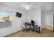 Bedroom with a ceiling fan, modern desk, and large window for natural light at 925 E Doris St, Avondale, AZ 85323