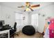 Bright bedroom featuring a ceiling fan and two windows, creating a cheerful space at 925 E Doris St, Avondale, AZ 85323