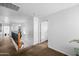 Hallway with carpeted floor, iron railing, and natural light, creating a warm and inviting atmosphere at 925 E Doris St, Avondale, AZ 85323