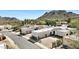 Aerial view of property in a desert-mountainous landscape featuring multiple buildings, driveways, and surrounding scenery at 9430 N 25Th St, Phoenix, AZ 85028