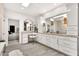 Bright bathroom with a large vanity area, stylish fixtures, and a clear view of the primary bedroom suite at 9430 N 25Th St, Phoenix, AZ 85028