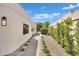 Manicured landscaping and privacy hedges adorn this beautifully landscaped side yard at 9430 N 25Th St, Phoenix, AZ 85028