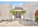 Inviting front entrance with a tiled overhang and potted palm trees at 9430 N 25Th St, Phoenix, AZ 85028