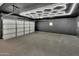 Spacious garage featuring epoxy flooring, custom ceiling lighting and ample space for vehicle and storage at 9430 N 25Th St, Phoenix, AZ 85028