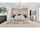 Spacious primary bedroom with a decorative accent wall, neutral palette, modern lighting, and plush carpeting at 9430 N 25Th St, Phoenix, AZ 85028