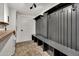 Mudroom features custom lockers, bench seating, and stylish tile flooring at 9430 N 25Th St, Phoenix, AZ 85028