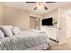 Well-lit bedroom with light color palette, ceiling fan, and closet at 9460 N 92Nd St # 119, Scottsdale, AZ 85258