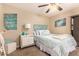 Cozy bedroom with coordinated decor, ceiling fan, and closet at 9460 N 92Nd St # 119, Scottsdale, AZ 85258