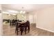 Inviting dining room featuring a mirrored wall, a modern chandelier, and stylish seating at 9460 N 92Nd St # 119, Scottsdale, AZ 85258