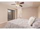 Comfortable main bedroom with sliding door access and an en-suite bathroom at 9460 N 92Nd St # 119, Scottsdale, AZ 85258